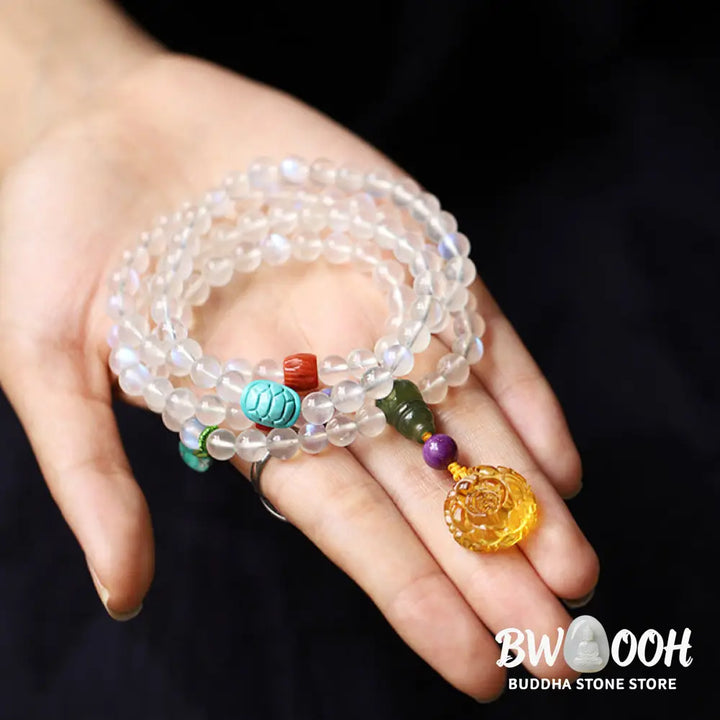 BWOOOH 108 Mala Beads bracelet handcrafted with shimmering Moonstone, warm Amber, vibrant Turquoise, and an engraved Lotus symbol, ideal for meditation and spiritual healing. - View 5
