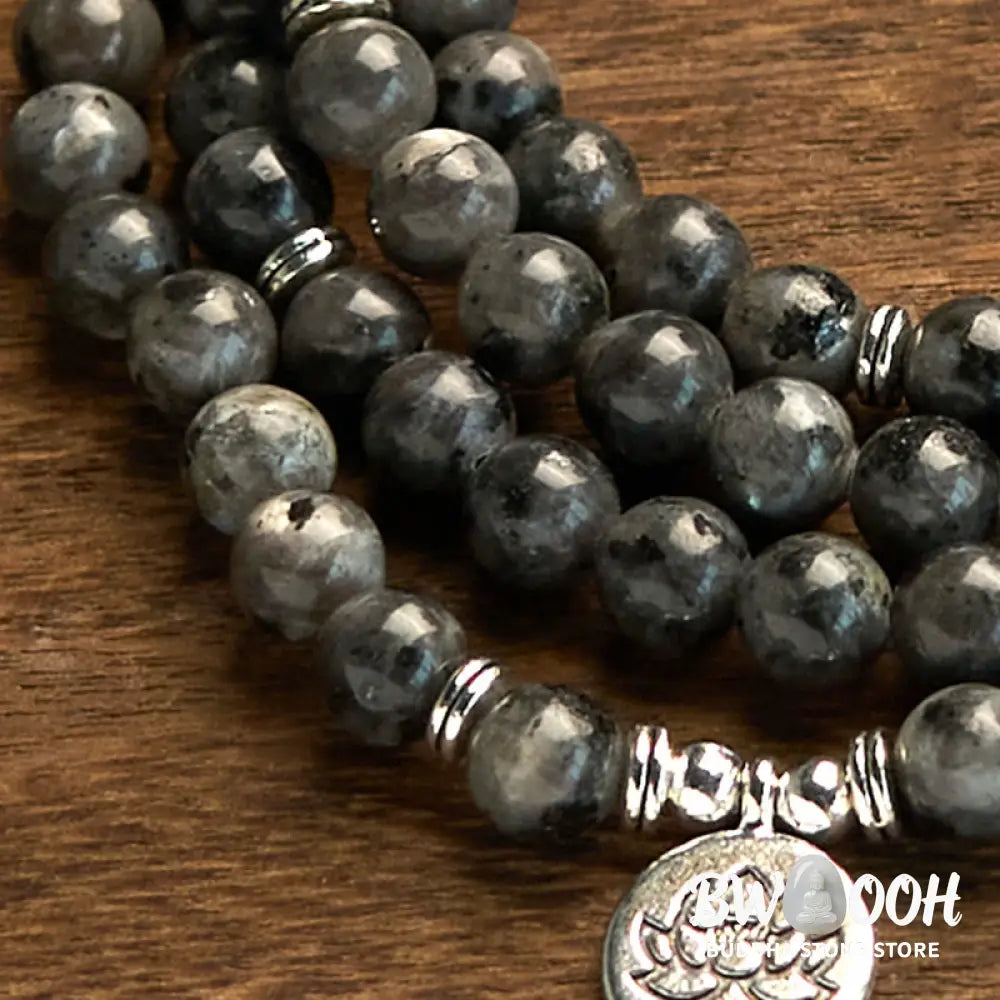 BWOOOH 108-bead multi-layer Black Glitter Stone Mala bracelet with engraved lotus pendant, symbolizing purity and strength, on a neutral background. - View 5