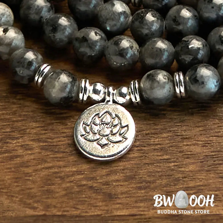BWOOOH 108-bead multi-layer Black Glitter Stone Mala bracelet with engraved lotus pendant, symbolizing purity and strength, on a neutral background. - View 6