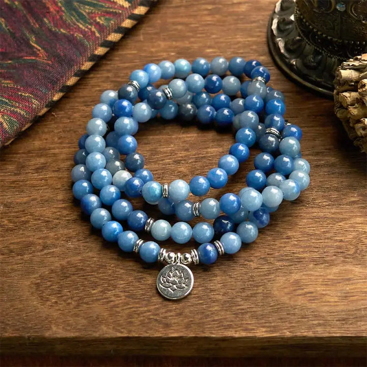 BWOOOH 108-bead multi-layer bracelet featuring 8mm natural Blue Aventurine beads and an engraved lotus pendant, symbolizing calm, spiritual growth, and inner peace.