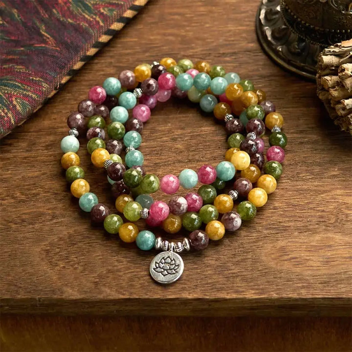 A multi-layer BWOOOH 108 Mala Beads Wisdom Bracelet featuring natural tourmaline beads and an engraved lotus pendant, symbolizing spiritual growth, calm, and protection. Ideal for mindful practice.