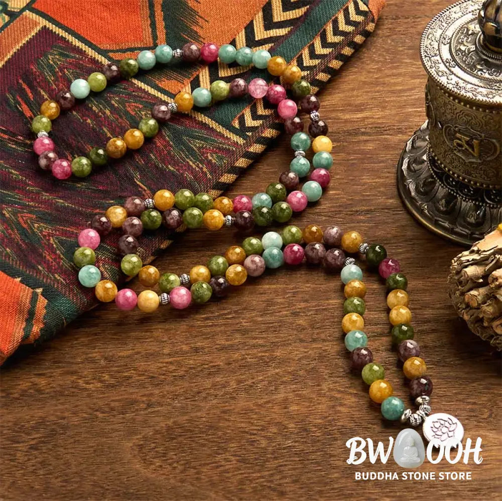 A multi-layer BWOOOH 108 Mala Beads Wisdom Bracelet featuring natural tourmaline beads and an engraved lotus pendant, symbolizing spiritual growth, calm, and protection. Ideal for mindful practice. - View 3