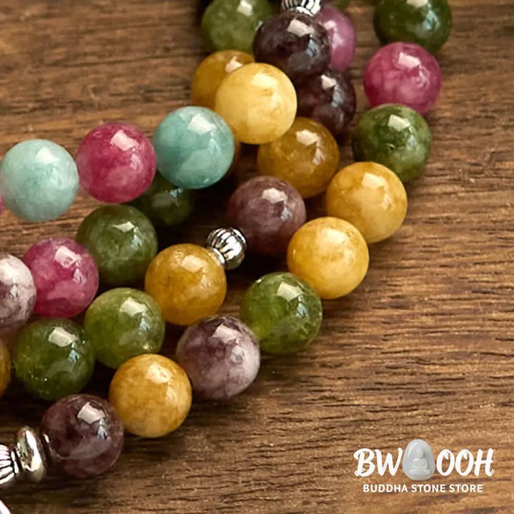 A multi-layer BWOOOH 108 Mala Beads Wisdom Bracelet featuring natural tourmaline beads and an engraved lotus pendant, symbolizing spiritual growth, calm, and protection. Ideal for mindful practice. - View 8