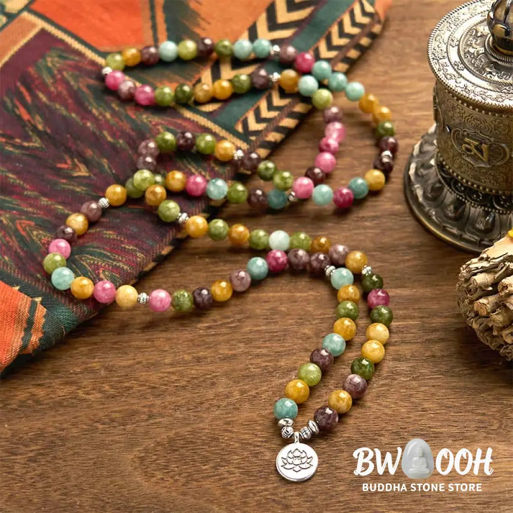 A multi-layer BWOOOH 108 Mala Beads Wisdom Bracelet featuring natural tourmaline beads and an engraved lotus pendant, symbolizing spiritual growth, calm, and protection. Ideal for mindful practice. - View 2