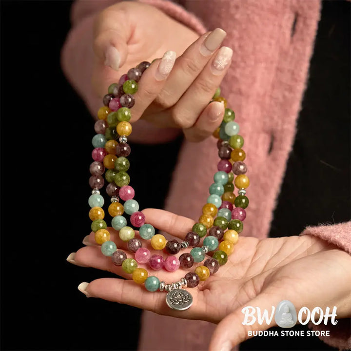A multi-layer BWOOOH 108 Mala Beads Wisdom Bracelet featuring natural tourmaline beads and an engraved lotus pendant, symbolizing spiritual growth, calm, and protection. Ideal for mindful practice. - View 5