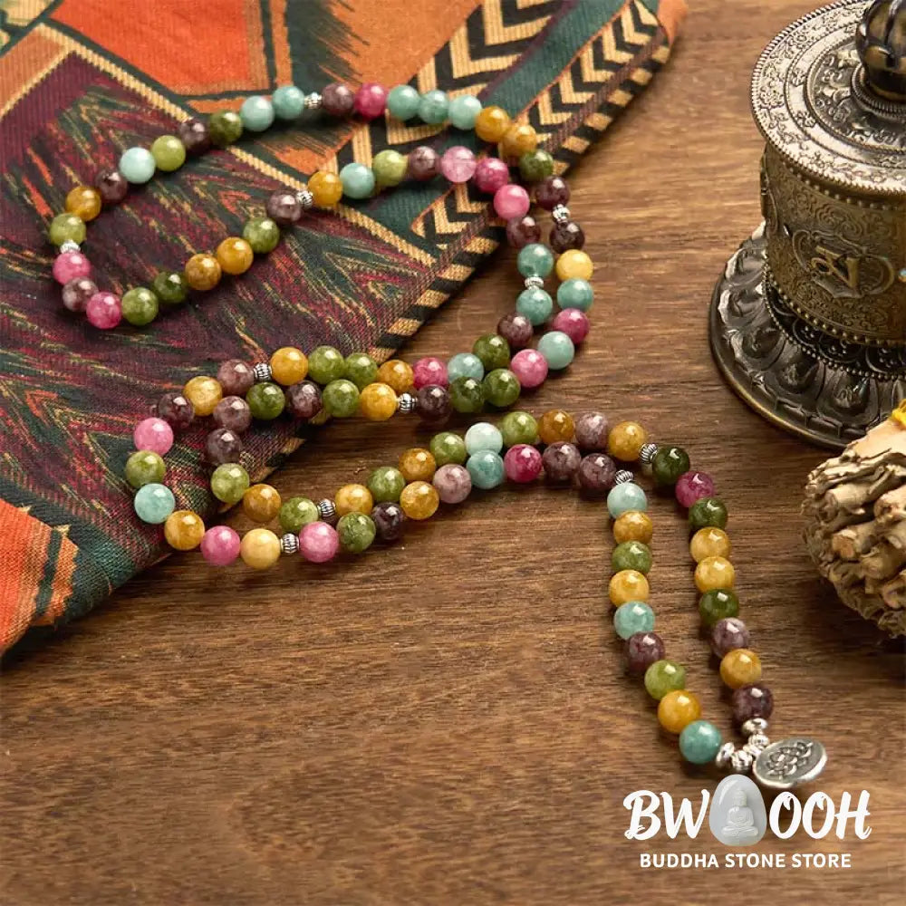 A multi-layer BWOOOH 108 Mala Beads Wisdom Bracelet featuring natural tourmaline beads and an engraved lotus pendant, symbolizing spiritual growth, calm, and protection. Ideal for mindful practice. - View 6