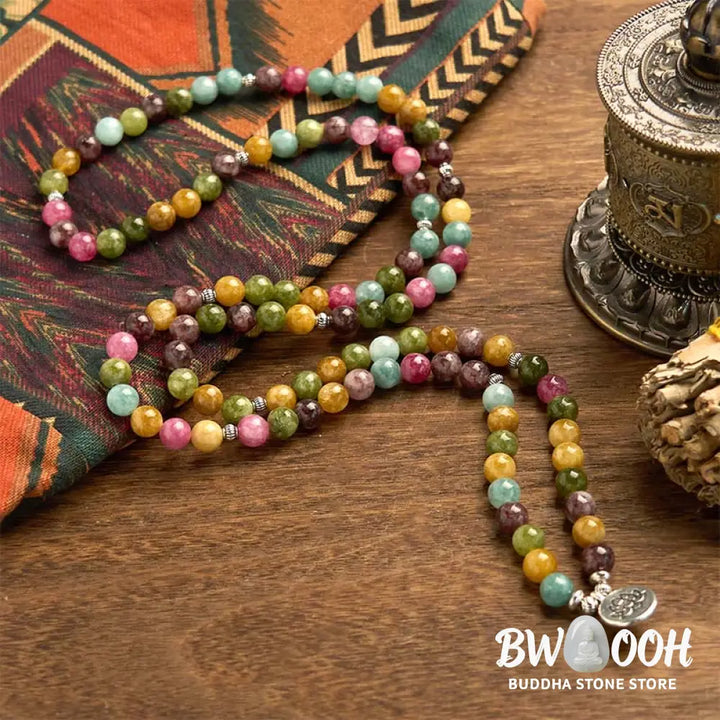 A multi-layer BWOOOH 108 Mala Beads Wisdom Bracelet featuring natural tourmaline beads and an engraved lotus pendant, symbolizing spiritual growth, calm, and protection. Ideal for mindful practice. - View 6