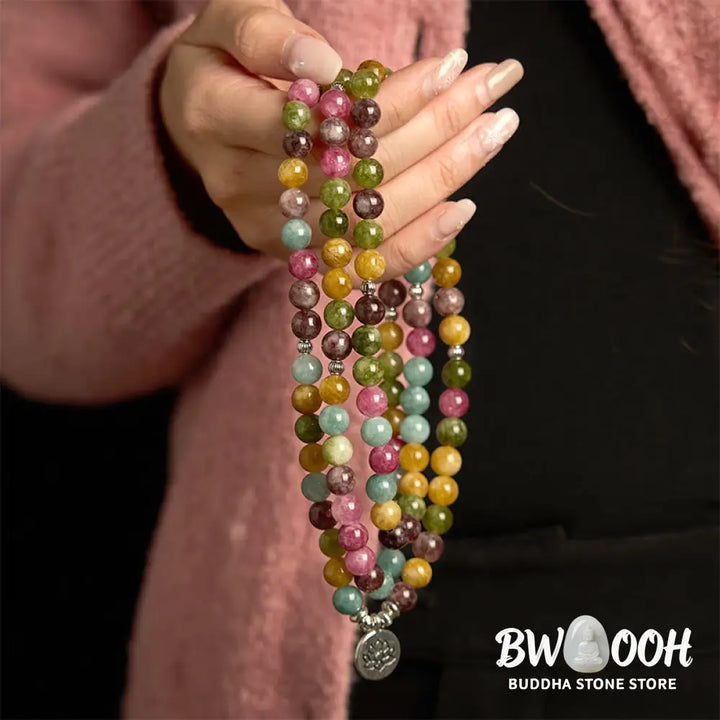 A multi-layer BWOOOH 108 Mala Beads Wisdom Bracelet featuring natural tourmaline beads and an engraved lotus pendant, symbolizing spiritual growth, calm, and protection. Ideal for mindful practice. - View 4