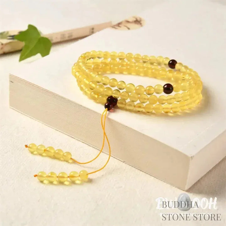 BWOOOH 108 Mala meditation bracelet featuring 5mm natural cherry amber beads, designed to clear anxiety, promote focus, and bring spiritual balance. - View 2