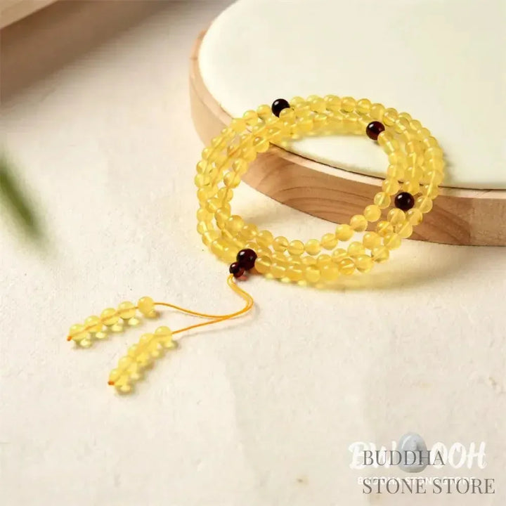 BWOOOH 108 Mala meditation bracelet featuring 5mm natural cherry amber beads, designed to clear anxiety, promote focus, and bring spiritual balance. - View 6