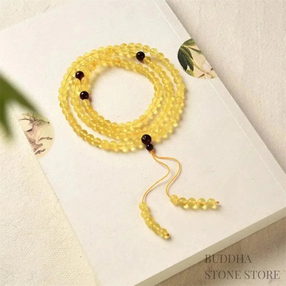 BWOOOH 108 Mala meditation bracelet featuring 5mm natural cherry amber beads, designed to clear anxiety, promote focus, and bring spiritual balance.