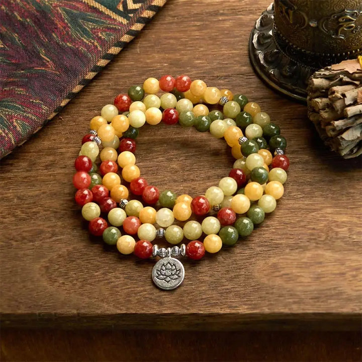 BWOOOH 108 Mala Beads bracelet, handcrafted with polished 8mm Topaz, Red Jasper, and Green Jasper stones on elastic string, featuring an engraved lotus pendant, shown on a neutral background, symbolizing protection and spiritual growth for mindfulness practices.