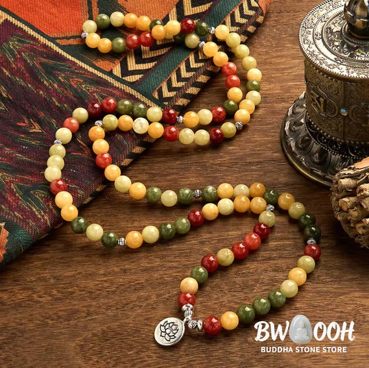 BWOOOH 108 Mala Beads bracelet, handcrafted with polished 8mm Topaz, Red Jasper, and Green Jasper stones on elastic string, featuring an engraved lotus pendant, shown on a neutral background, symbolizing protection and spiritual growth for mindfulness practices. - View 2