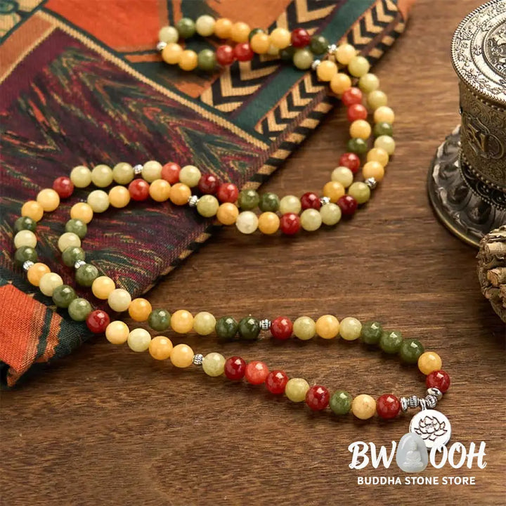BWOOOH 108 Mala Beads bracelet, handcrafted with polished 8mm Topaz, Red Jasper, and Green Jasper stones on elastic string, featuring an engraved lotus pendant, shown on a neutral background, symbolizing protection and spiritual growth for mindfulness practices. - View 3