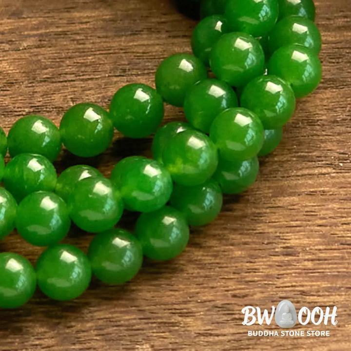 A BWOOOH 108-bead natural Cyan Jade mala bracelet, featuring smooth 8mm blue-green beads strung on premium elastic, ideal for meditation and daily wear. - View 7