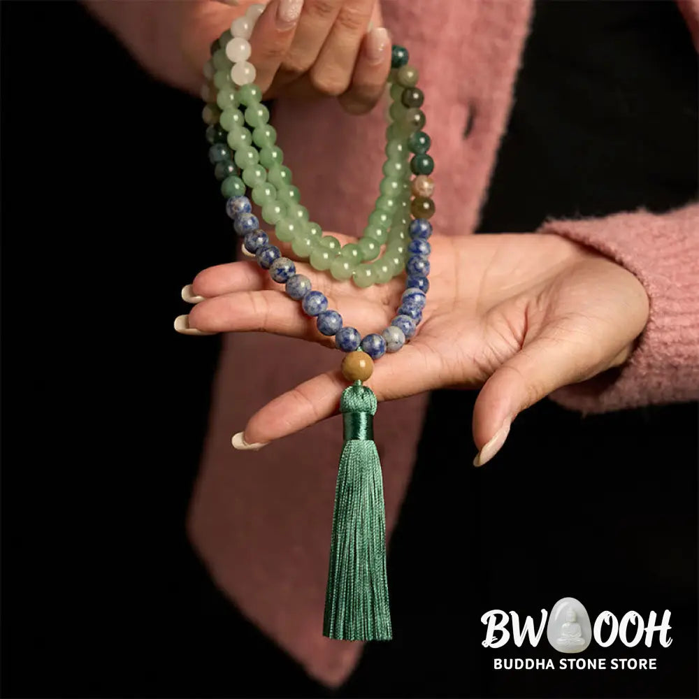 BWOOOH 108 Mala bracelet featuring 8mm natural Green Aventurine, Blue Spot Jasper, and Indian Agate beads with a vibrant green tassel, displayed on a meditation cushion, symbolizing luck, serenity, and balance for mindfulness practices. - View 4