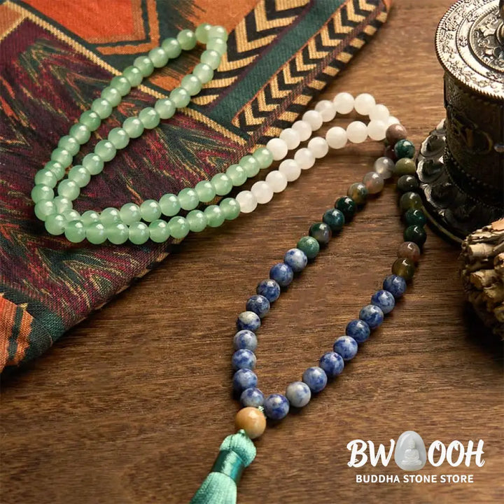 BWOOOH 108 Mala bracelet featuring 8mm natural Green Aventurine, Blue Spot Jasper, and Indian Agate beads with a vibrant green tassel, displayed on a meditation cushion, symbolizing luck, serenity, and balance for mindfulness practices. - View 5