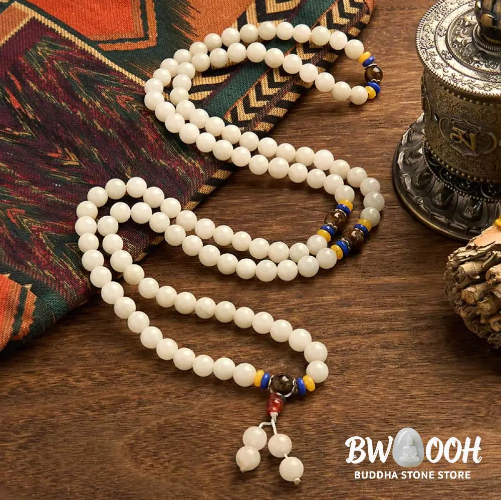 A close-up of the BWOOOH 108 Mala Beads Natural Quartzite Wealth Luck Bracelet, featuring polished 8mm quartzite and tiger eye beads on an elastic string, subtly revealing variations in natural color, embodying spiritual balance and prosperity. - View 8