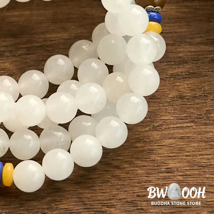 A close-up of the BWOOOH 108 Mala Beads Natural Quartzite Wealth Luck Bracelet, featuring polished 8mm quartzite and tiger eye beads on an elastic string, subtly revealing variations in natural color, embodying spiritual balance and prosperity. - View 13