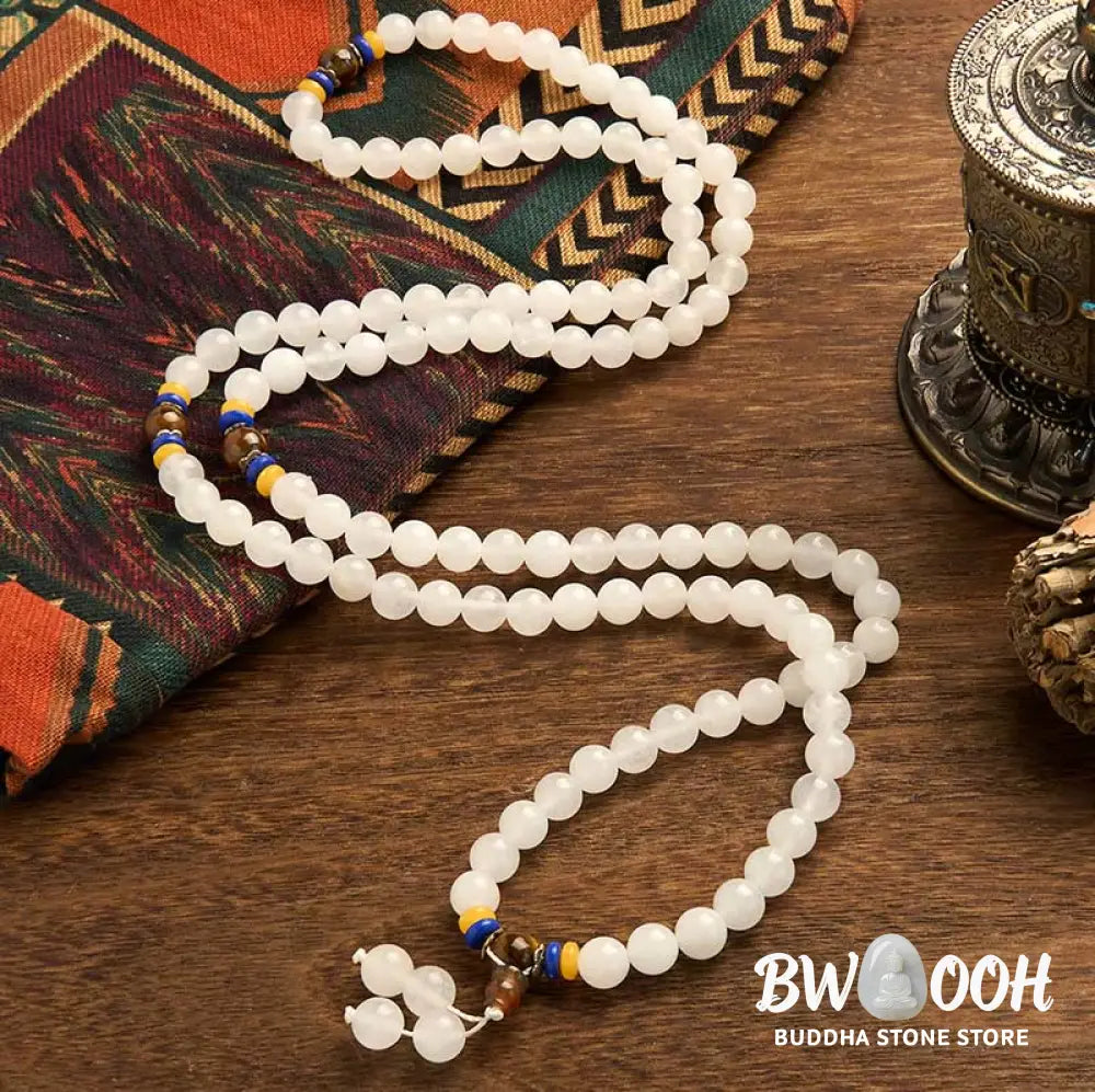 A close-up of the BWOOOH 108 Mala Beads Natural Quartzite Wealth Luck Bracelet, featuring polished 8mm quartzite and tiger eye beads on an elastic string, subtly revealing variations in natural color, embodying spiritual balance and prosperity. - View 2