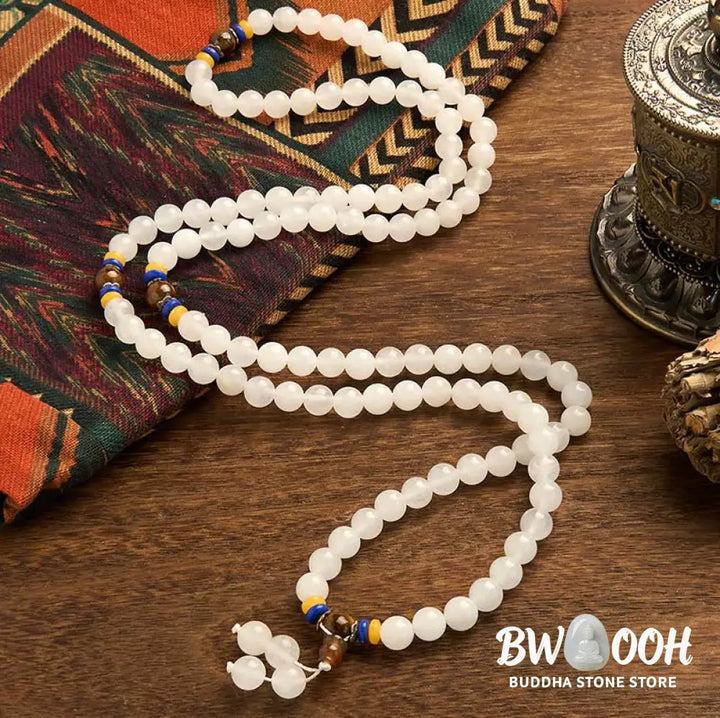 A close-up of the BWOOOH 108 Mala Beads Natural Quartzite Wealth Luck Bracelet, featuring polished 8mm quartzite and tiger eye beads on an elastic string, subtly revealing variations in natural color, embodying spiritual balance and prosperity. - View 2