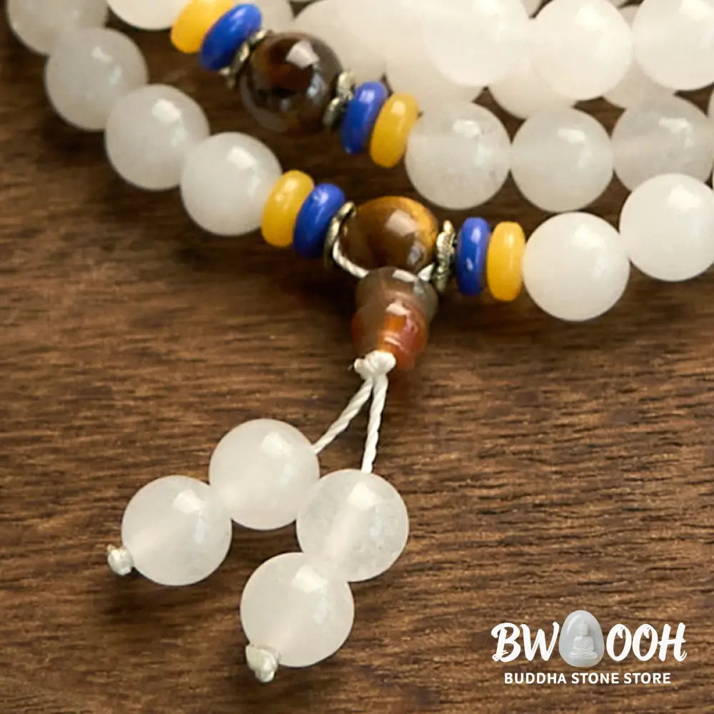 A close-up of the BWOOOH 108 Mala Beads Natural Quartzite Wealth Luck Bracelet, featuring polished 8mm quartzite and tiger eye beads on an elastic string, subtly revealing variations in natural color, embodying spiritual balance and prosperity. - View 14