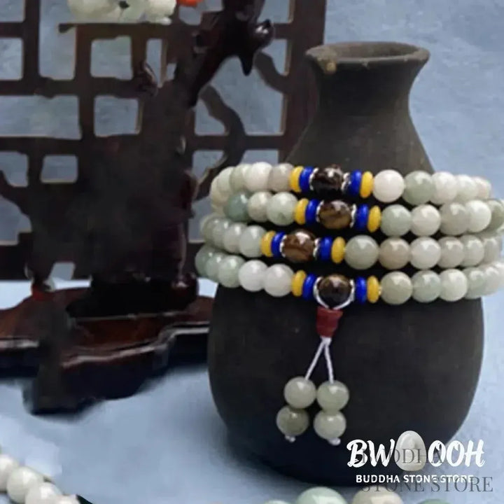 BWOOOH 108 Mala meditation bracelet featuring polished 8mm natural Shetai jade beads and subtle tiger eye accents on a premium elastic string, displaying a uniform, rich green hue for spiritual balance, luck, and prosperity. - View 2
