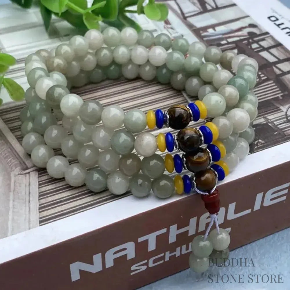 BWOOOH 108 Mala meditation bracelet featuring polished 8mm natural Shetai jade beads and subtle tiger eye accents on a premium elastic string, displaying a uniform, rich green hue for spiritual balance, luck, and prosperity.