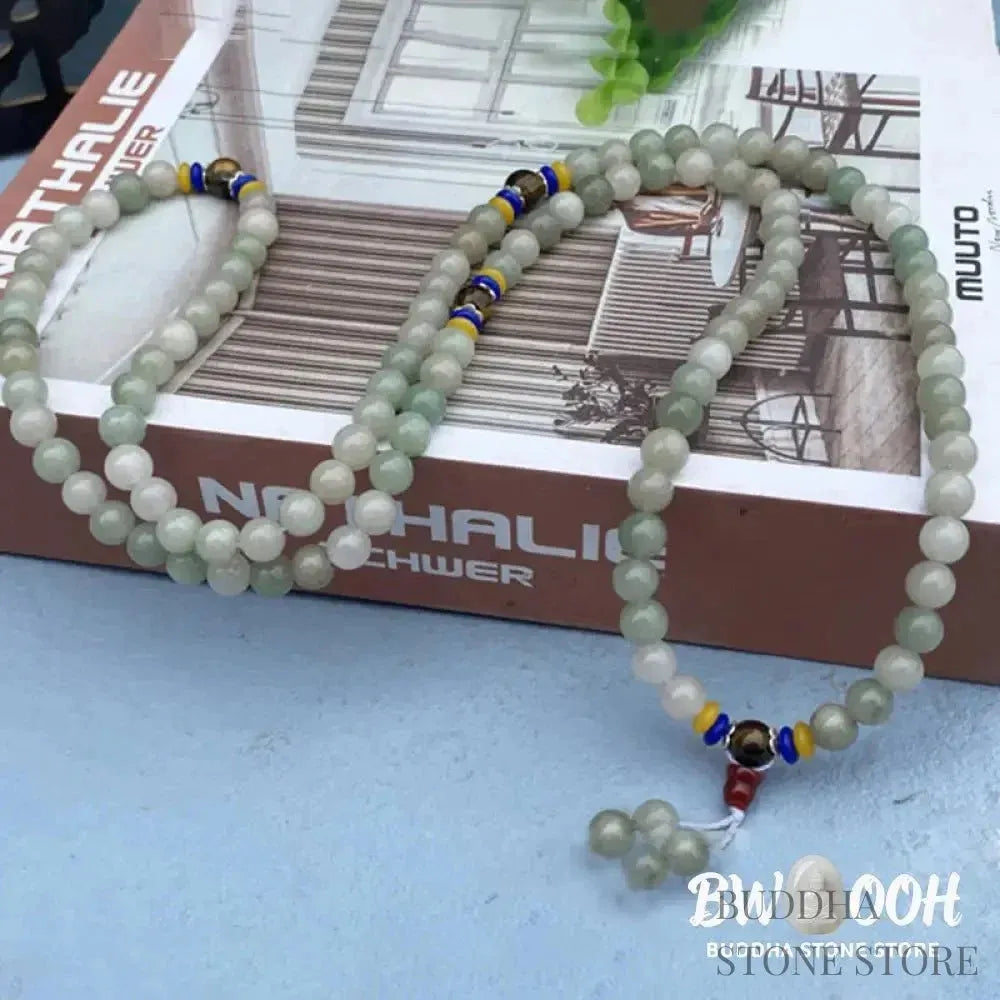 BWOOOH 108 Mala meditation bracelet featuring polished 8mm natural Shetai jade beads and subtle tiger eye accents on a premium elastic string, displaying a uniform, rich green hue for spiritual balance, luck, and prosperity. - View 3