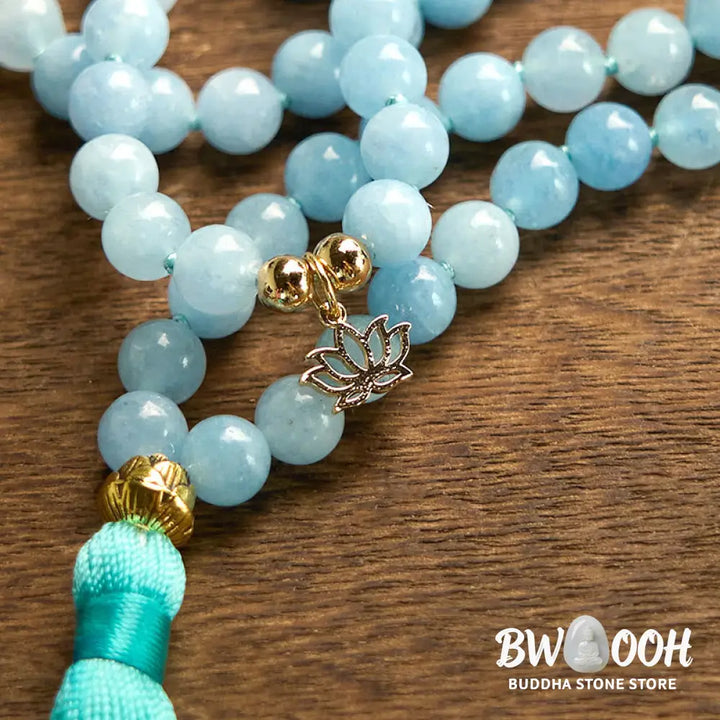 BWOOOH 108 Aquamarine Mala meditation bracelet featuring 8mm natural aquamarine beads and a delicate hollow lotus pendant, designed for spiritual healing and inner peace. Unisex, elastic string fit. - View 9