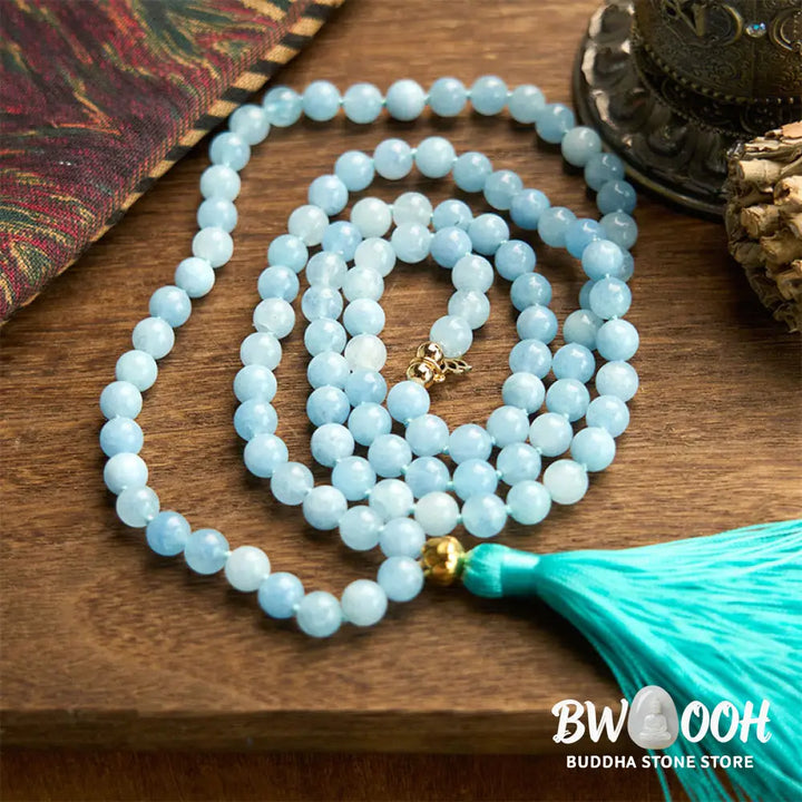 BWOOOH 108 Aquamarine Mala meditation bracelet featuring 8mm natural aquamarine beads and a delicate hollow lotus pendant, designed for spiritual healing and inner peace. Unisex, elastic string fit. - View 6