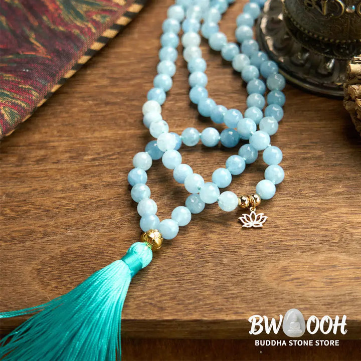 BWOOOH 108 Aquamarine Mala meditation bracelet featuring 8mm natural aquamarine beads and a delicate hollow lotus pendant, designed for spiritual healing and inner peace. Unisex, elastic string fit. - View 8