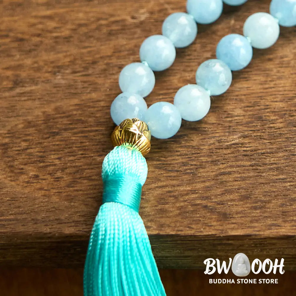 BWOOOH 108 Aquamarine Mala meditation bracelet featuring 8mm natural aquamarine beads and a delicate hollow lotus pendant, designed for spiritual healing and inner peace. Unisex, elastic string fit. - View 11