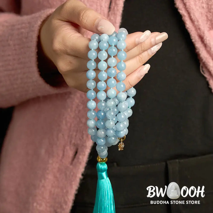 BWOOOH 108 Aquamarine Mala meditation bracelet featuring 8mm natural aquamarine beads and a delicate hollow lotus pendant, designed for spiritual healing and inner peace. Unisex, elastic string fit. - View 4