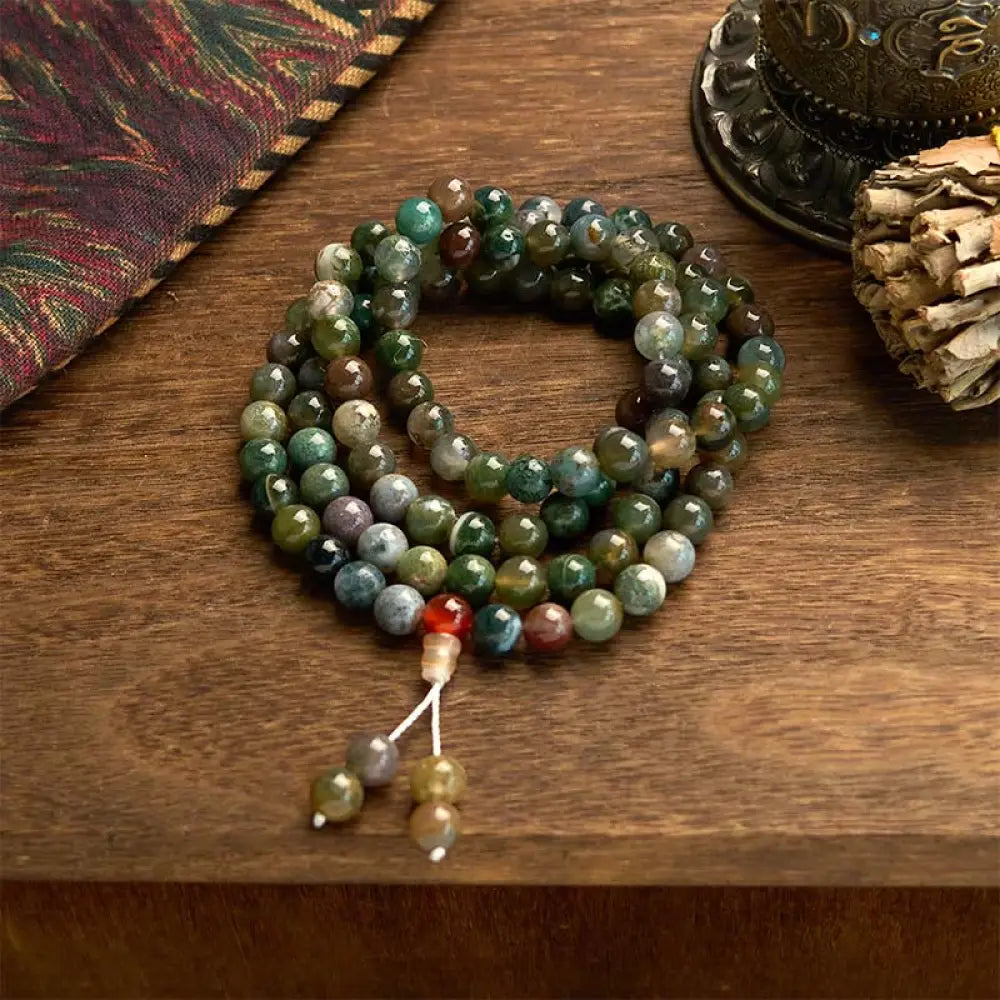 BWOOOH 108 Mala Beads Natural Moss Agate multi-turn healing bracelet. Features 8mm green beads on elastic string, symbolizing growth and harmony for a unisex fit.