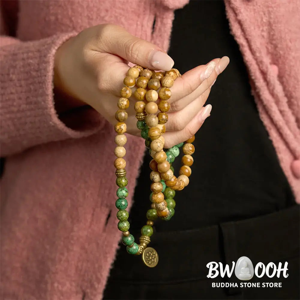 BWOOOH 108 Mala bracelet featuring earth-toned Picture Jasper and vibrant Turquoise 8mm beads, meticulously strung on premium elastic, with a prominent round silver lotus pendant symbolizing purity and growth. Ideal for mindful reflection. - View 3