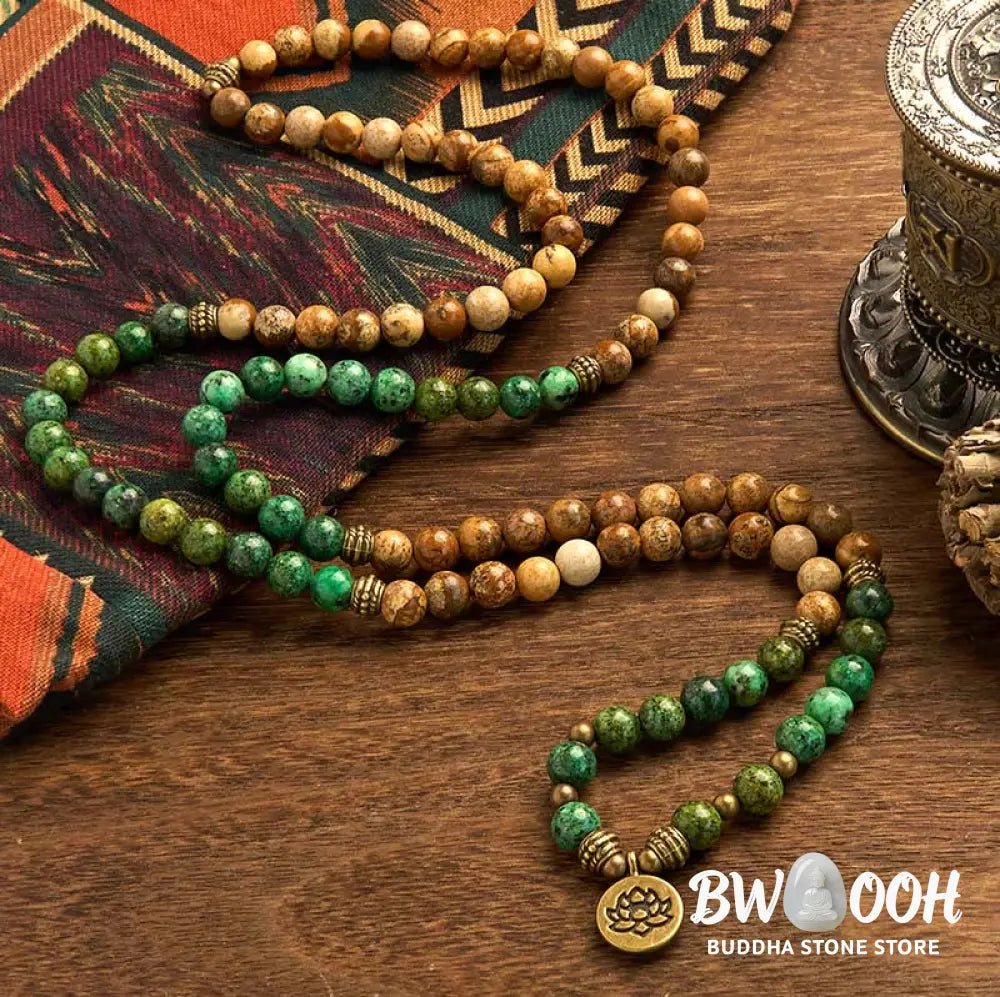 BWOOOH 108 Mala bracelet featuring earth-toned Picture Jasper and vibrant Turquoise 8mm beads, meticulously strung on premium elastic, with a prominent round silver lotus pendant symbolizing purity and growth. Ideal for mindful reflection. - View 2