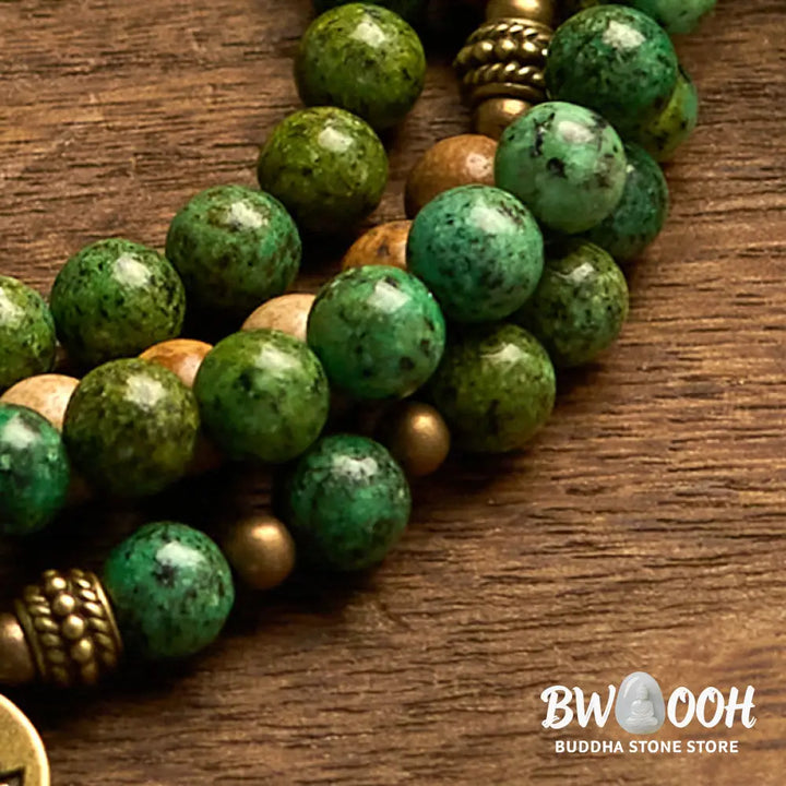 BWOOOH 108 Mala bracelet featuring earth-toned Picture Jasper and vibrant Turquoise 8mm beads, meticulously strung on premium elastic, with a prominent round silver lotus pendant symbolizing purity and growth. Ideal for mindful reflection. - View 6