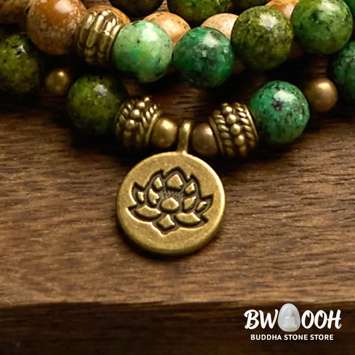 BWOOOH 108 Mala bracelet featuring earth-toned Picture Jasper and vibrant Turquoise 8mm beads, meticulously strung on premium elastic, with a prominent round silver lotus pendant symbolizing purity and growth. Ideal for mindful reflection. - View 8