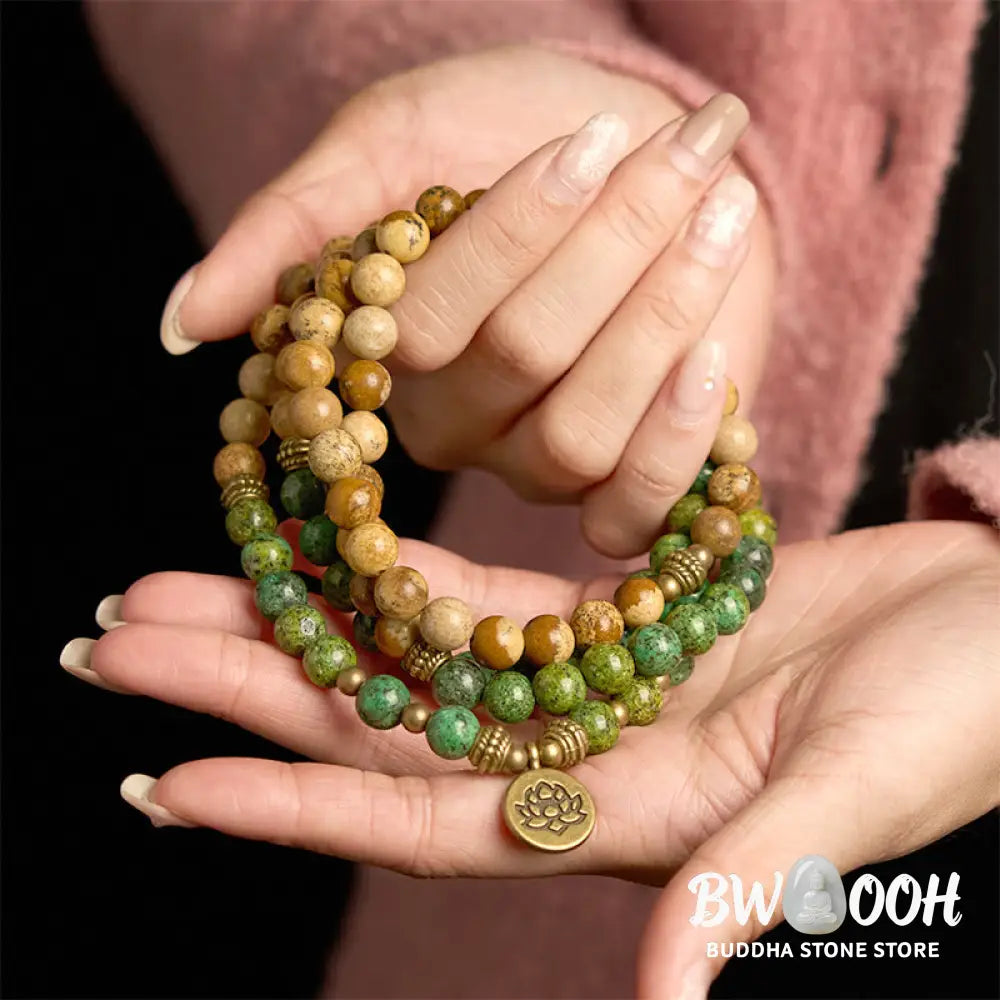 BWOOOH 108 Mala bracelet featuring earth-toned Picture Jasper and vibrant Turquoise 8mm beads, meticulously strung on premium elastic, with a prominent round silver lotus pendant symbolizing purity and growth. Ideal for mindful reflection. - View 5