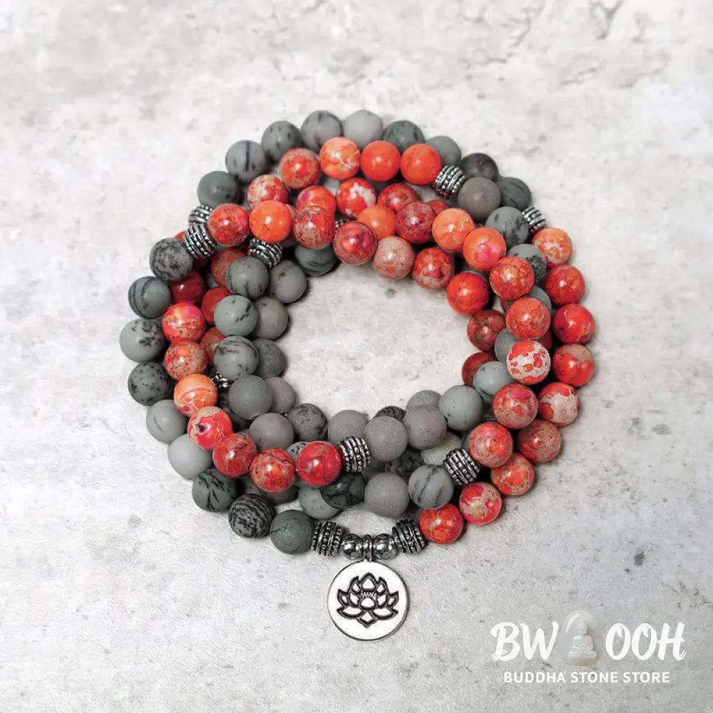 BWOOOH 108-bead Sea Sediment Jasper Lotus Protection Bracelet, displaying natural blue-green and orange Jasper beads with a silver-tone lotus charm, laid against a neutral background. - View 2