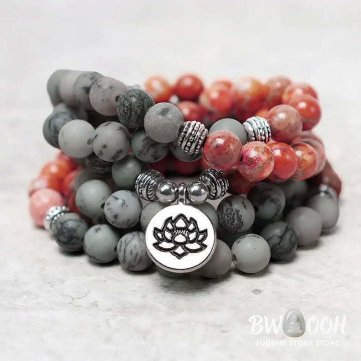 BWOOOH 108-bead Sea Sediment Jasper Lotus Protection Bracelet, displaying natural blue-green and orange Jasper beads with a silver-tone lotus charm, laid against a neutral background. - View 3