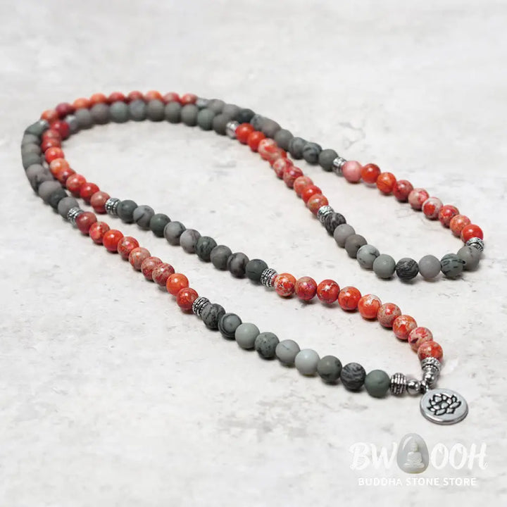 BWOOOH 108-bead Sea Sediment Jasper Lotus Protection Bracelet, displaying natural blue-green and orange Jasper beads with a silver-tone lotus charm, laid against a neutral background. - View 4