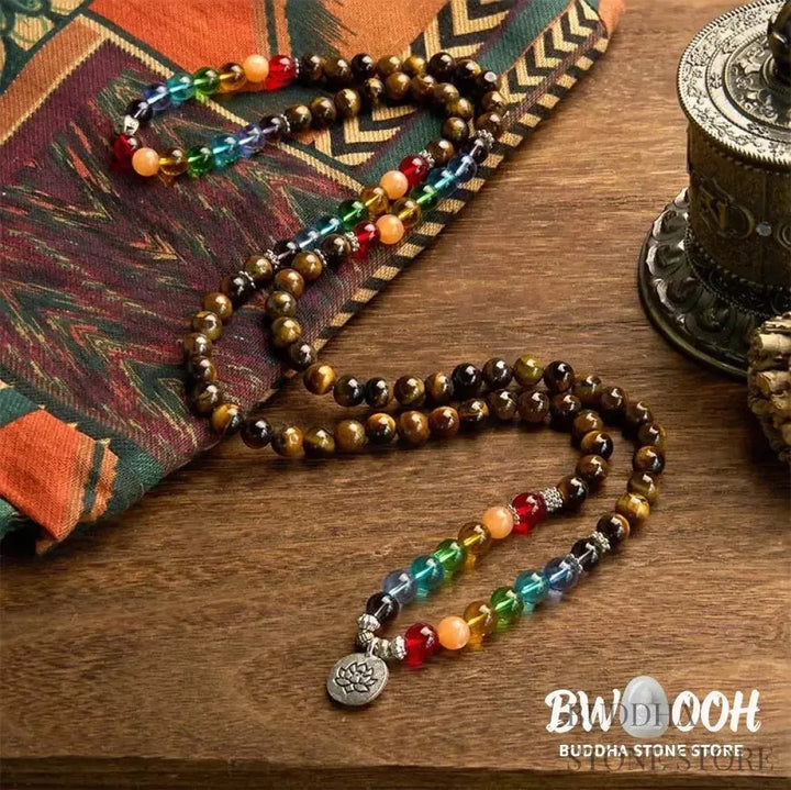 BWOOOH 108 Mala Beads bracelet featuring 8mm natural Tiger Eye and colorful glass beads on an elastic string, adorned with an engraved lotus pendant, symbolizing purity and protection. Unisex design for spiritual practice. - View 2