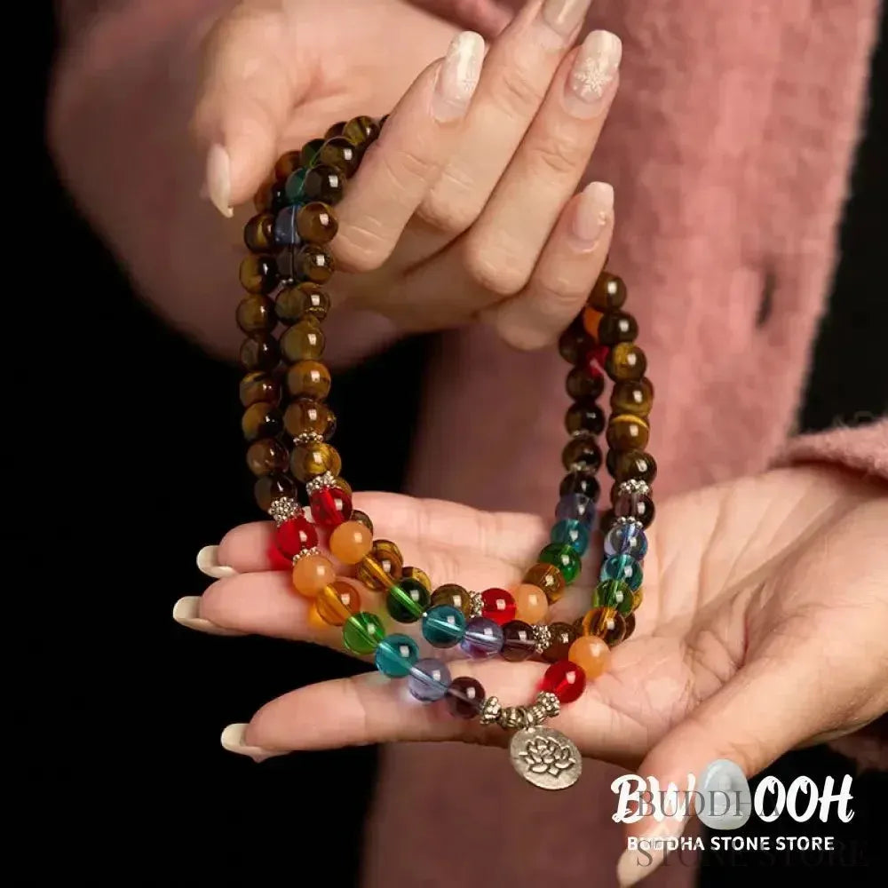 BWOOOH 108 Mala Beads bracelet featuring 8mm natural Tiger Eye and colorful glass beads on an elastic string, adorned with an engraved lotus pendant, symbolizing purity and protection. Unisex design for spiritual practice. - View 4
