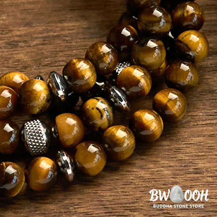 BWOOOH 108 Mala Beads multi-turn bracelet featuring polished 8mm natural Tiger Eye stones and stainless steel accents, worn on a wrist for spiritual protection and mindful meditation. - View 6