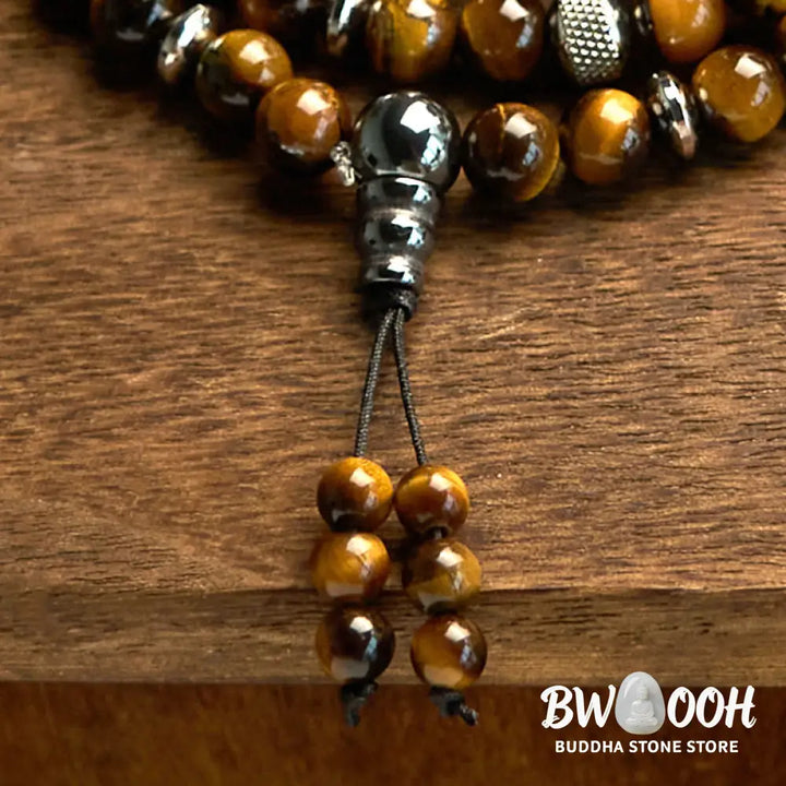 BWOOOH 108 Mala Beads multi-turn bracelet featuring polished 8mm natural Tiger Eye stones and stainless steel accents, worn on a wrist for spiritual protection and mindful meditation. - View 5