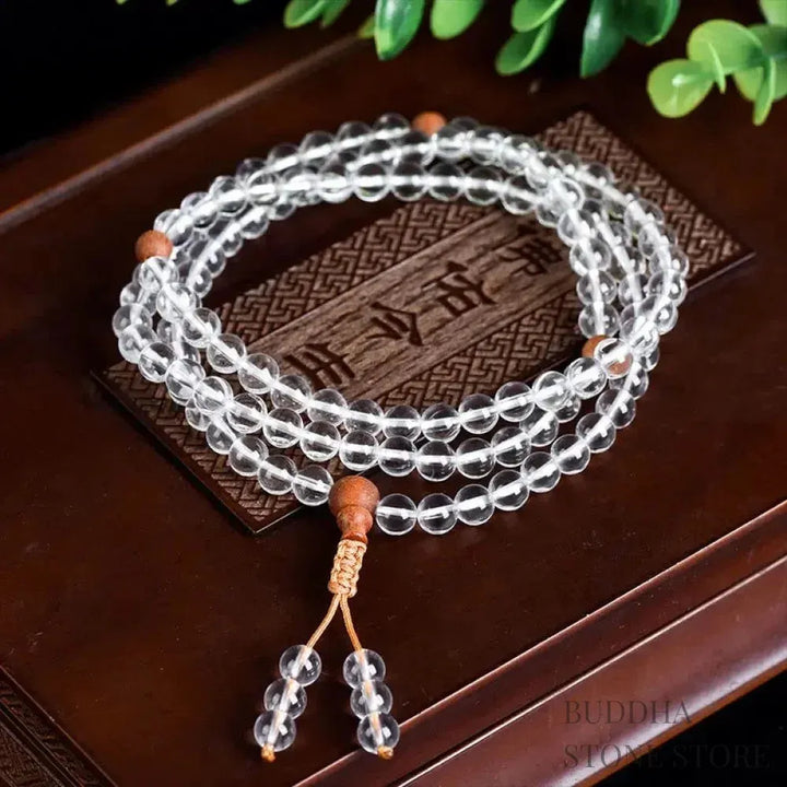 BWOOOH 108 Mala Beads, a unisex meditation bracelet featuring 6mm natural white crystal and distinct sandalwood beads, elegantly wrapped on a premium elastic string.