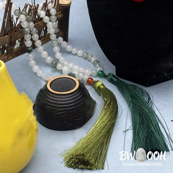 BWOOOH 108 Mala Beads Bracelet featuring polished natural Tianshan Jade, accented with a vibrant tassel. This exquisite meditation and luck accessory showcases the unique jade stone, interwoven with South Red Agate and Green Agate, designed for spiritual balance and attracting prosperity. - View 3
