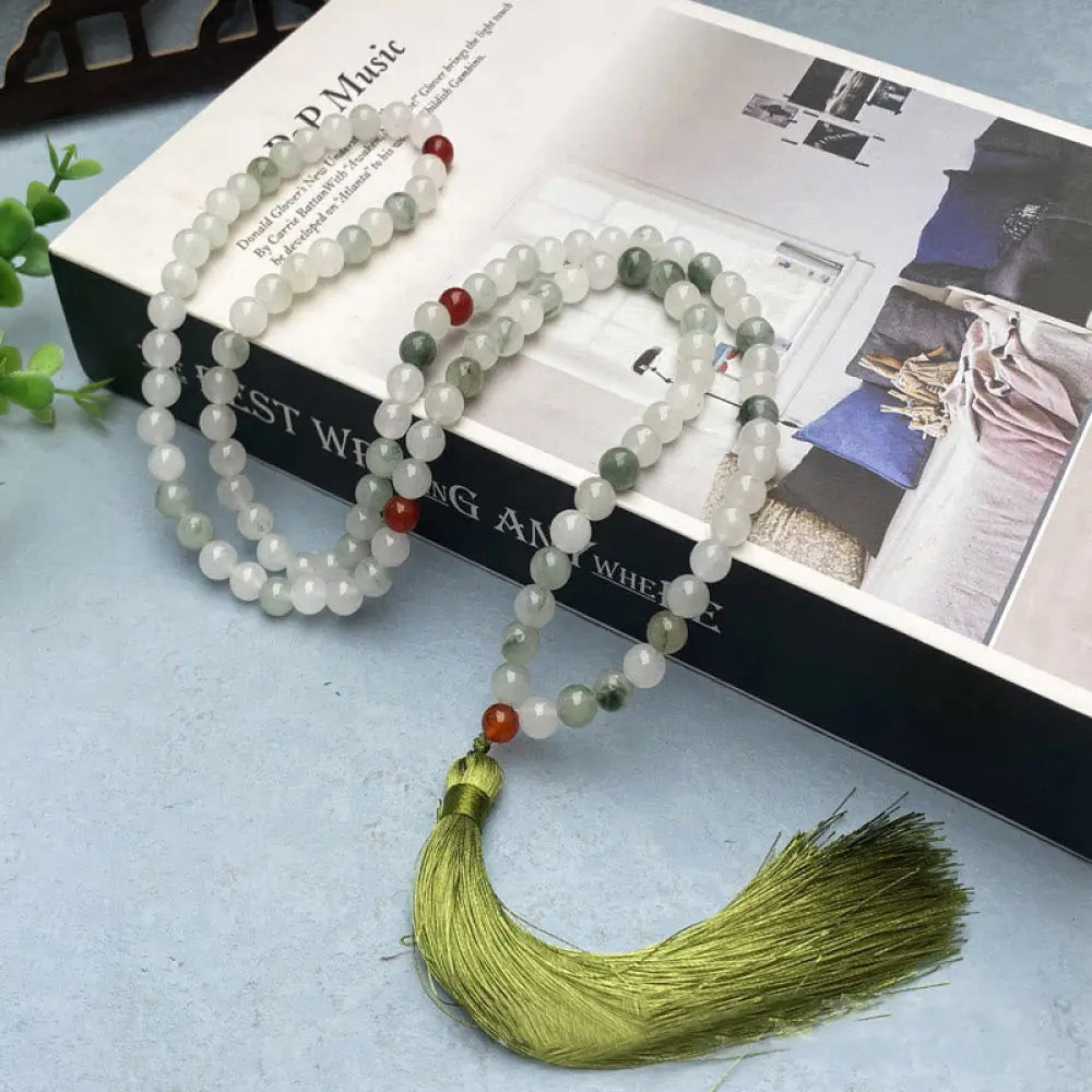 BWOOOH 108 Mala Beads Bracelet featuring polished natural Tianshan Jade, accented with a vibrant tassel. This exquisite meditation and luck accessory showcases the unique jade stone, interwoven with South Red Agate and Green Agate, designed for spiritual balance and attracting prosperity. - View 5